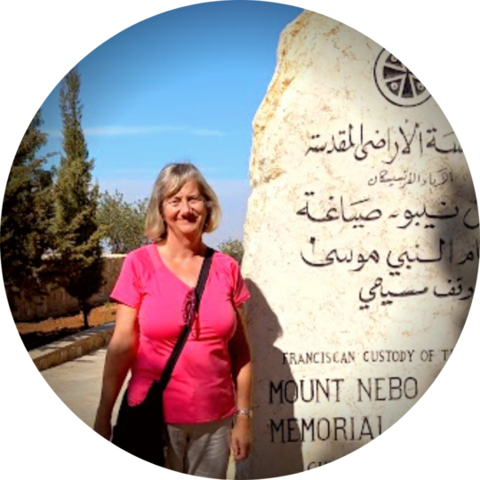 Jan standing beside the Mount Nebo Moses Memorial stone in Madaba, Jordan